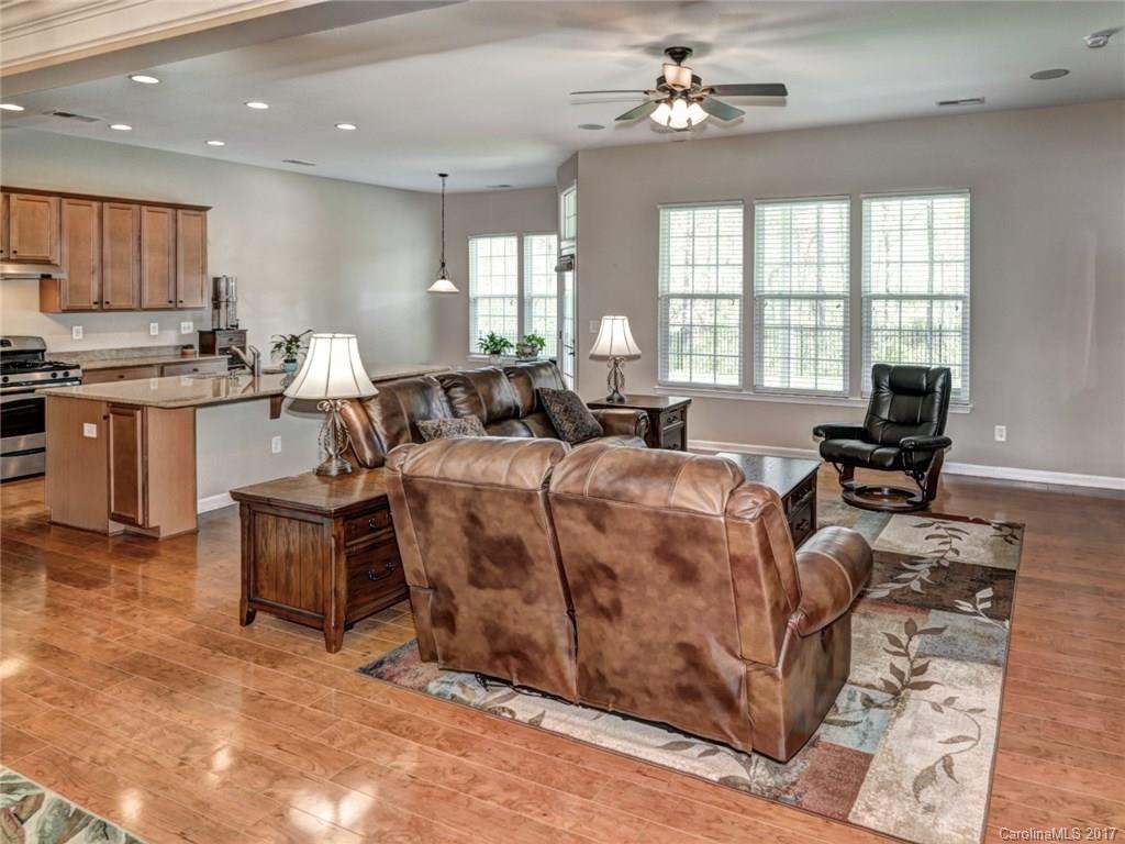 15731 Kiser Corner Lane Davidson, NC 28036 - Photo 7 of 24 a living room with fireplace furniture and a large window