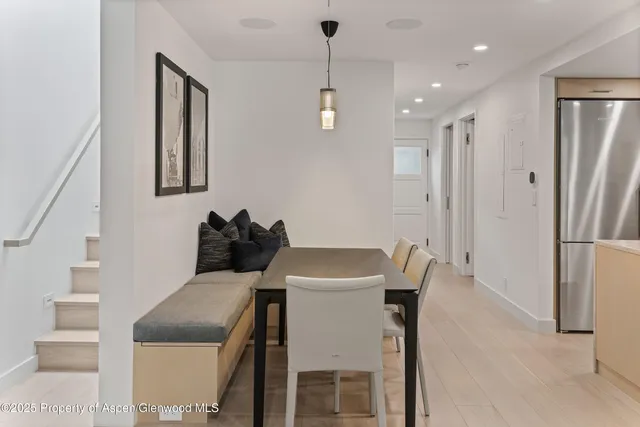 a kitchen with a table and chairs