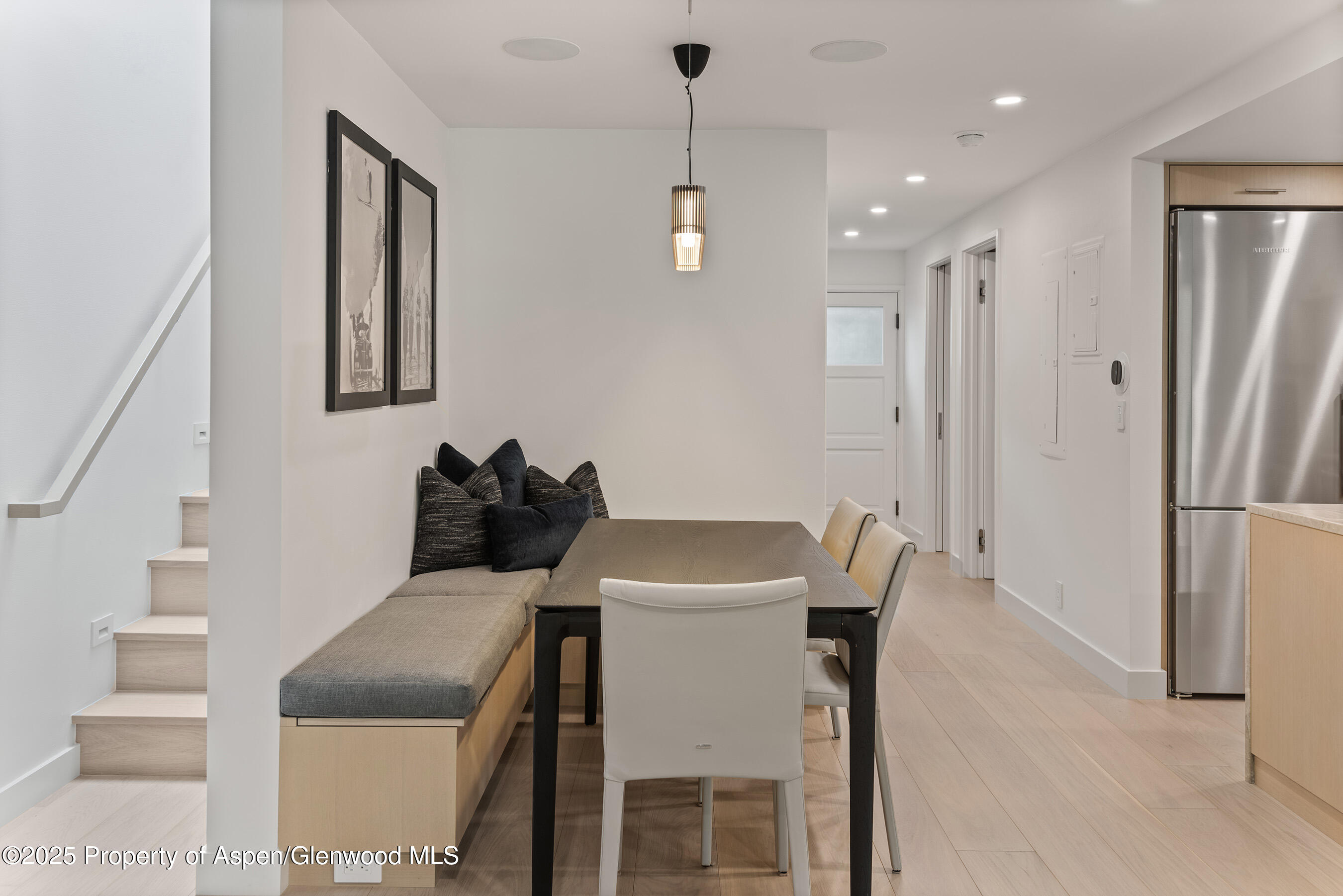 800 East Hopkins Avenue, Unit B5 Aspen, CO 81611 - Photo 12 of 29 a kitchen with a table and chairs