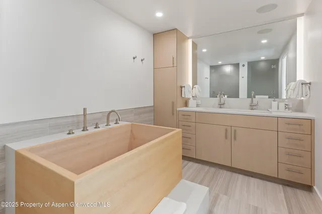 a bathroom with a sink a vanity and a mirror