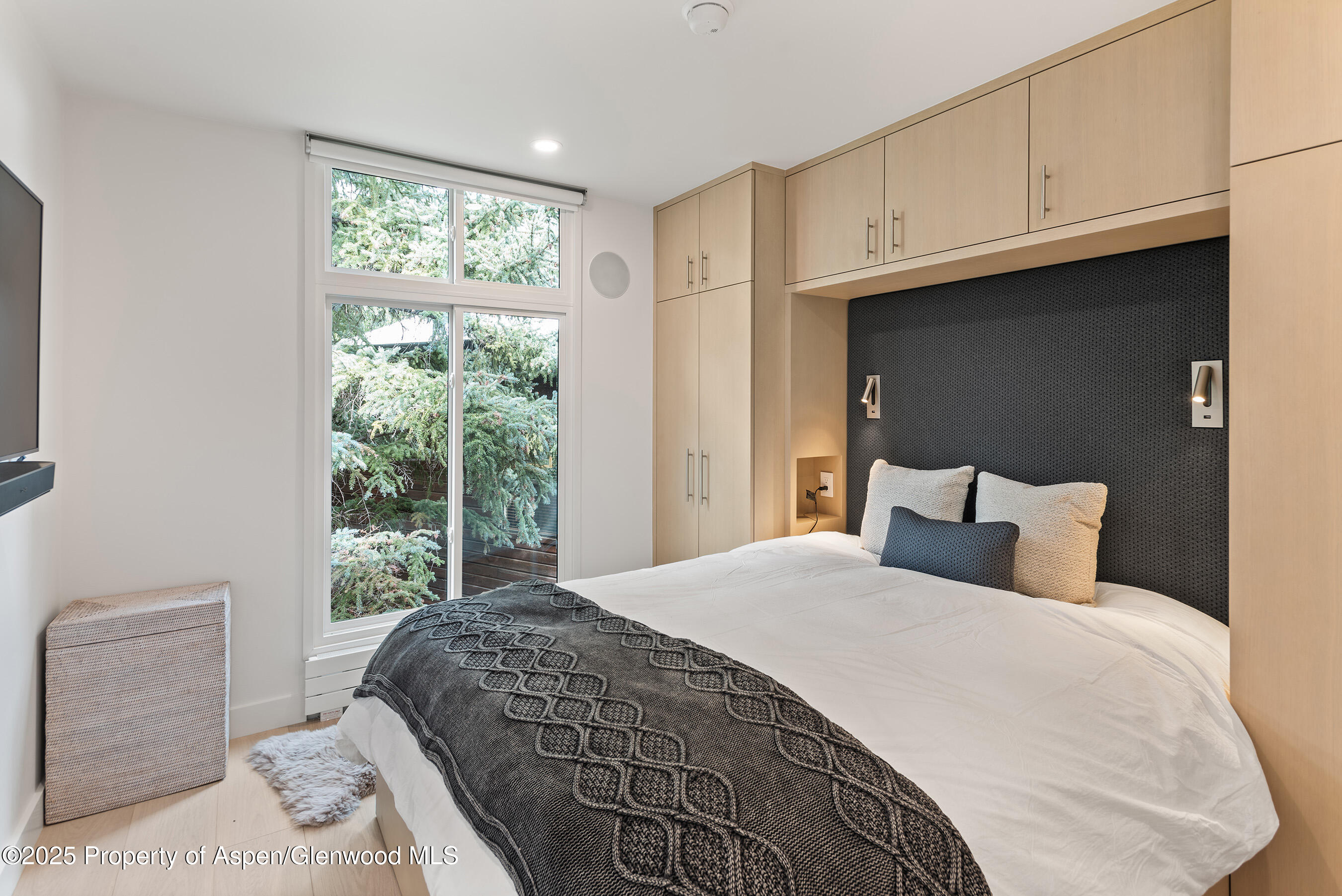 800 East Hopkins Avenue, Unit B5 Aspen, CO 81611 - Photo 20 of 29 a bedroom with a bed and window