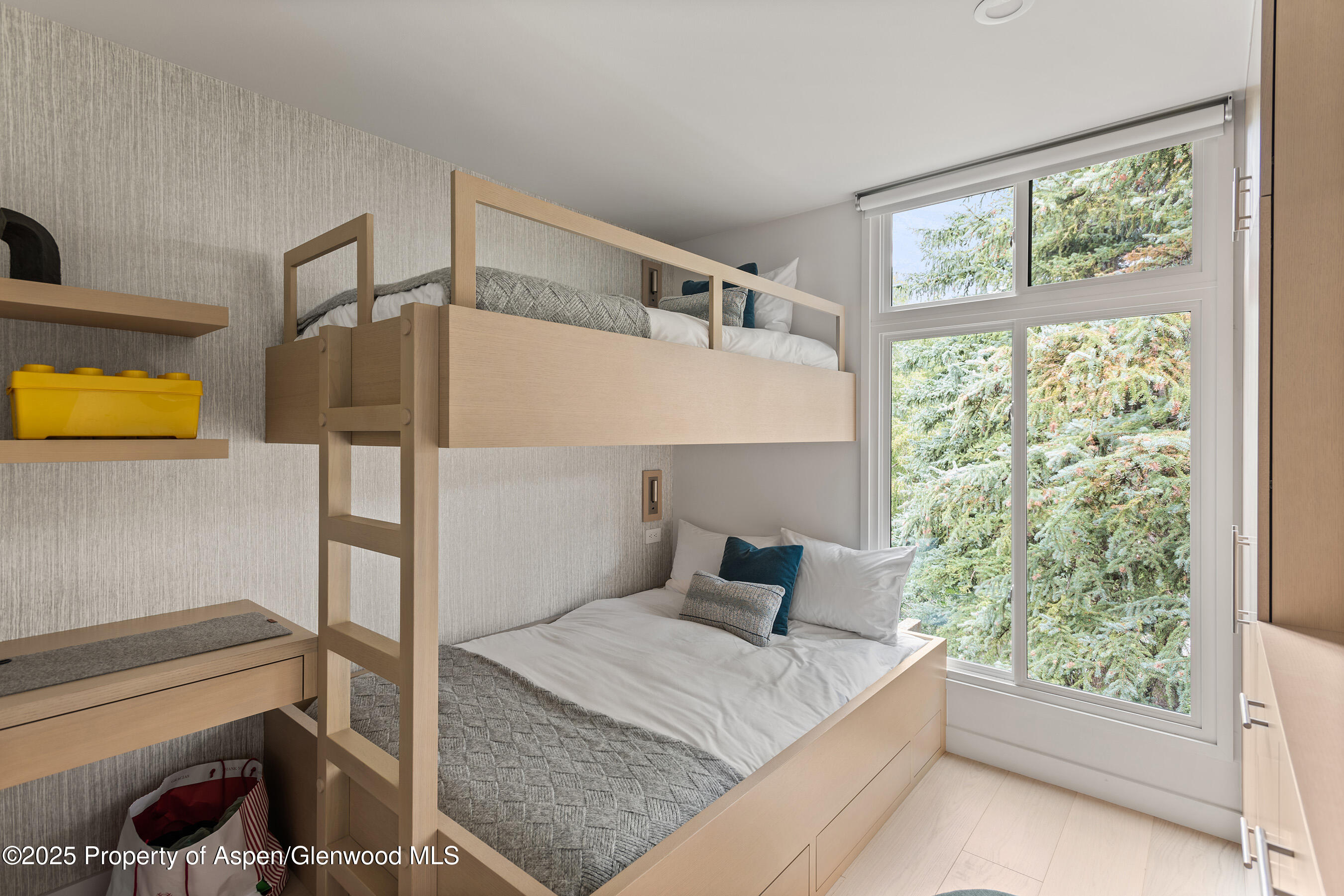 800 East Hopkins Avenue, Unit B5 Aspen, CO 81611 - Photo 22 of 29 a bedroom with a bed and a window