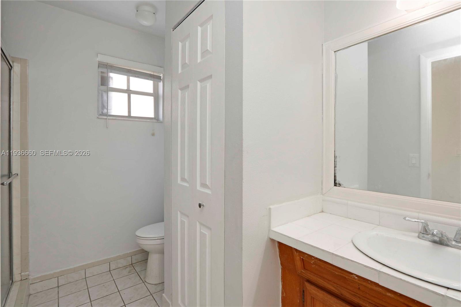 13254 Southwest 255th Terrace Homestead, FL 33032 - Photo 11 of 23 a bathroom with a sink a toilet and shower