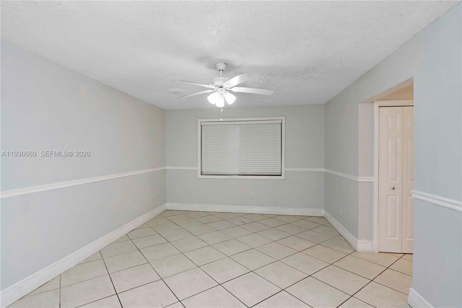 13254 Southwest 255th Terrace Homestead, FL 33032 - Photo 12 of 23 a view of an empty room with a window