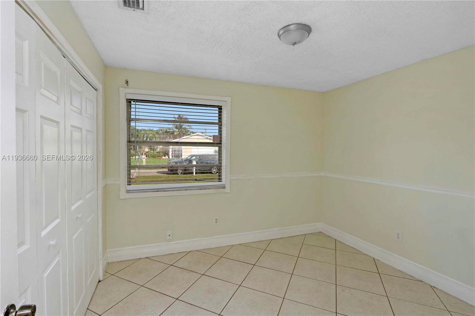 13254 Southwest 255th Terrace Homestead, FL 33032 - Photo 16 of 23 a view of an empty room with window