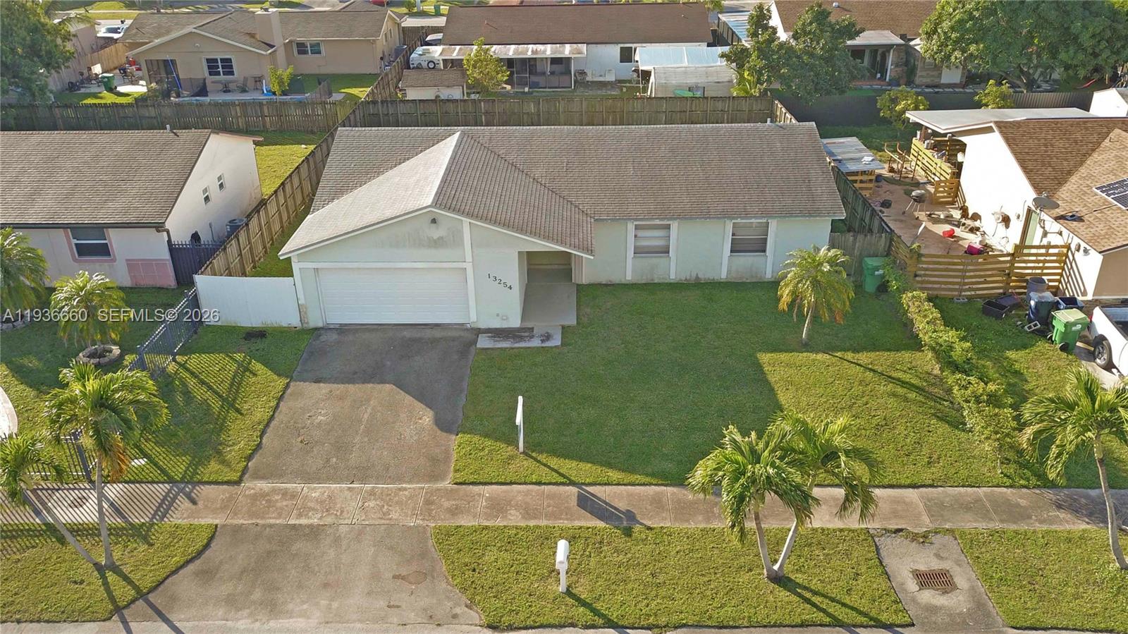 13254 Southwest 255th Terrace Homestead, FL 33032 - Photo 2 of 23 an aerial view of a house