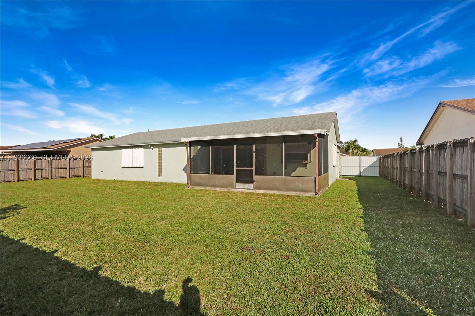 13254 Southwest 255th Terrace Homestead, FL 33032 - Photo 21 of 23 a front view of a house with garden
