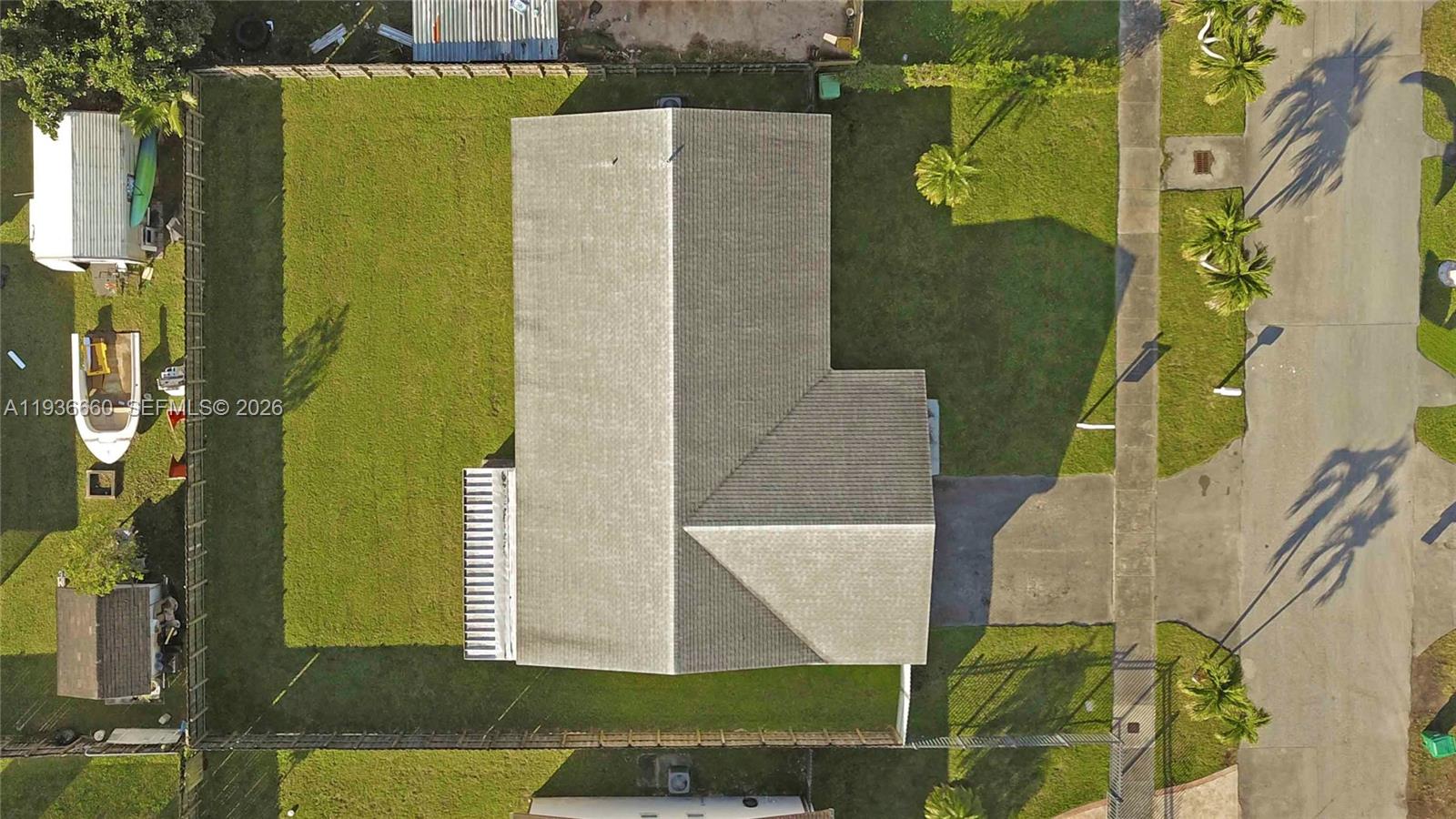 13254 Southwest 255th Terrace Homestead, FL 33032 - Photo 3 of 23 an aerial view of a house with a swimming pool