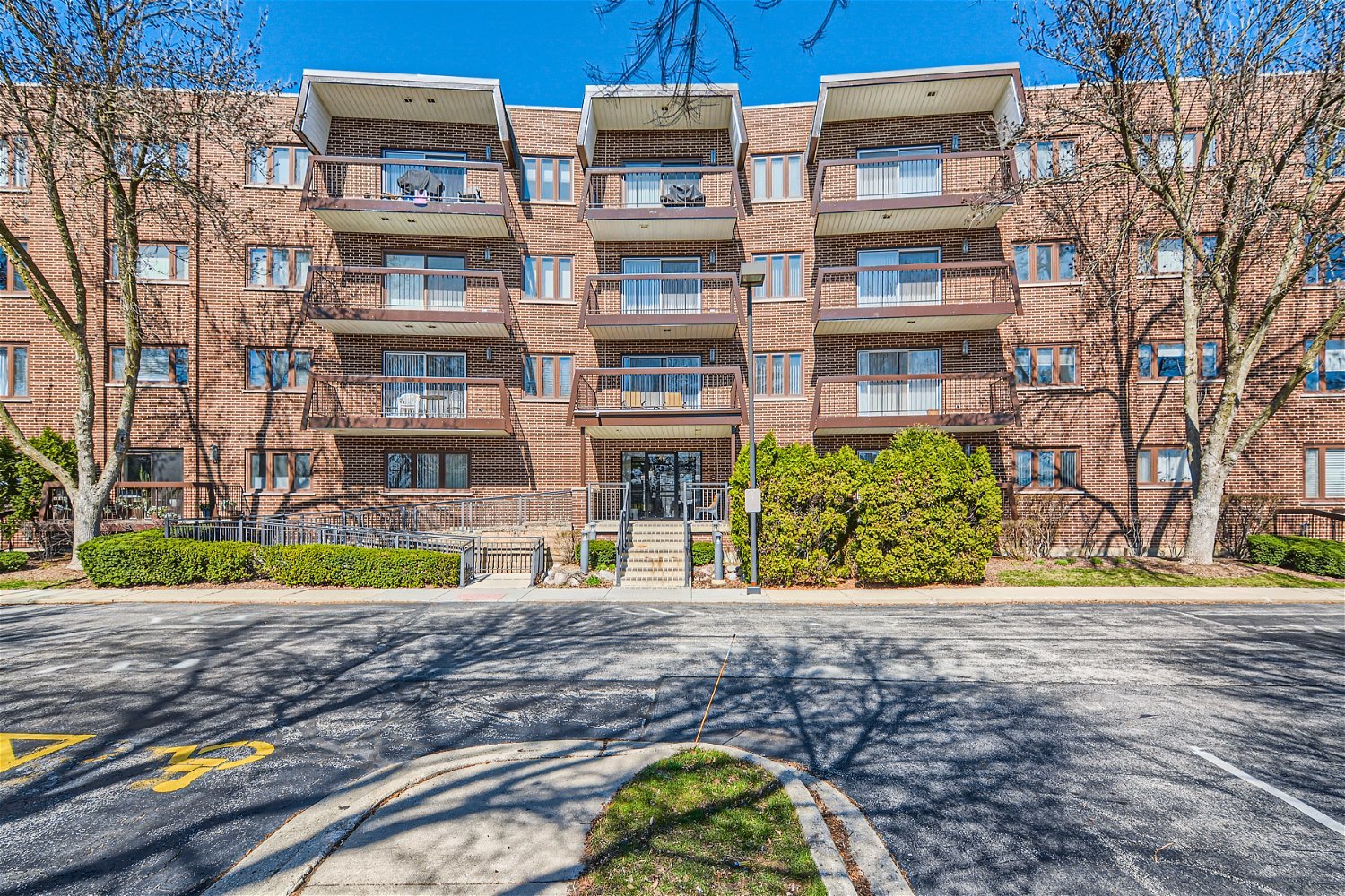 a front view of a building with garden