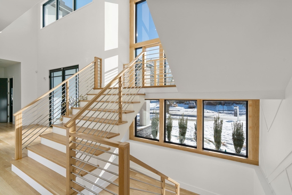 53 Countryside Road, Unit 53 Newton, MA 02459 - Photo 4 of 40 a view of staircase with large window