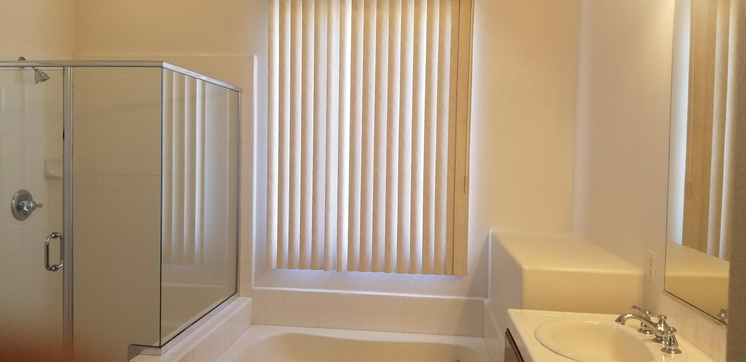 42375 Warner Trail Palm Desert, CA 92211 - Photo 19 of 33 a bathroom with a shower curtain and a sink