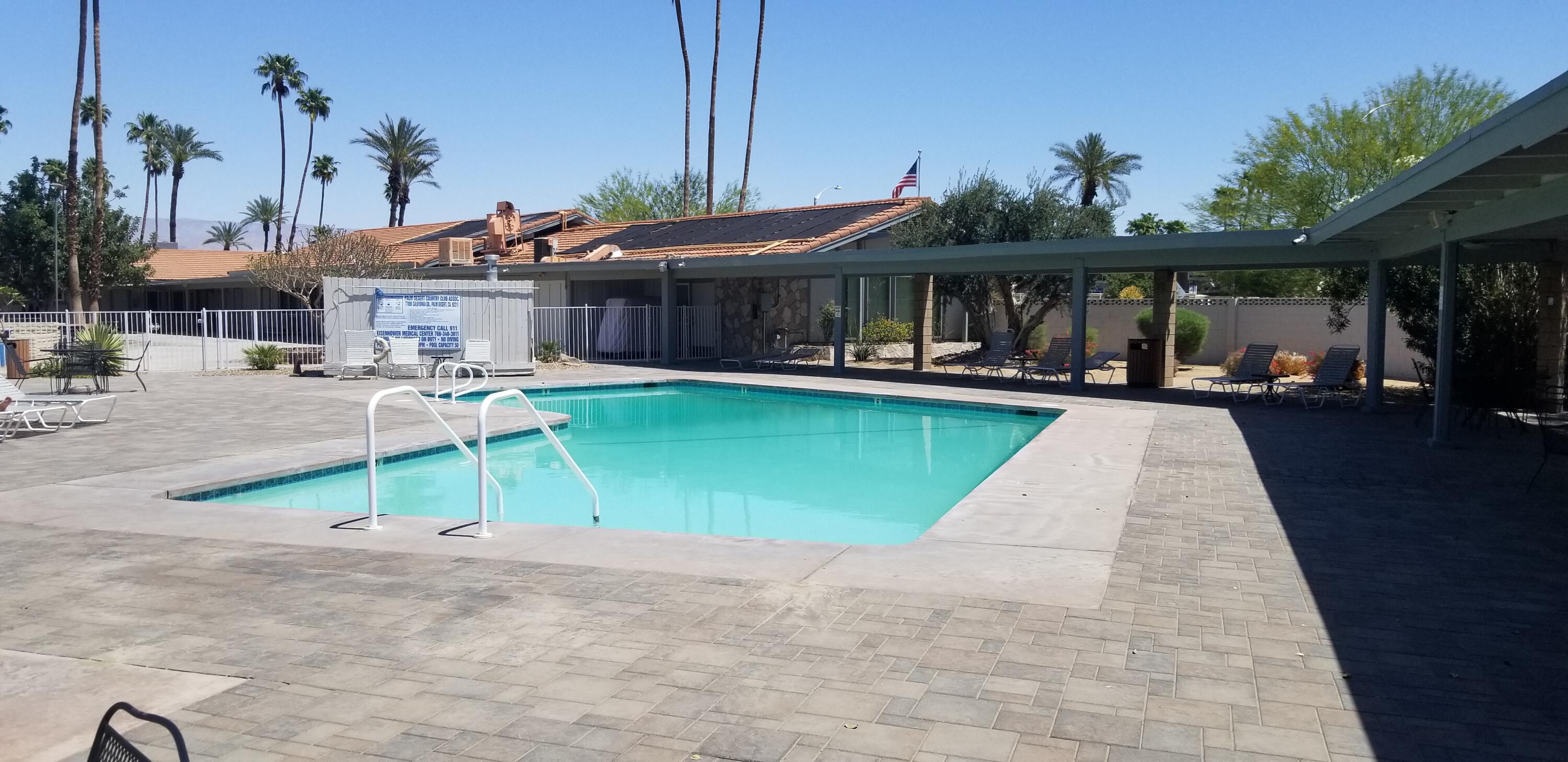 42375 Warner Trail Palm Desert, CA 92211 - Photo 31 of 33 a view of a patio with a table and chairs under an umbrella