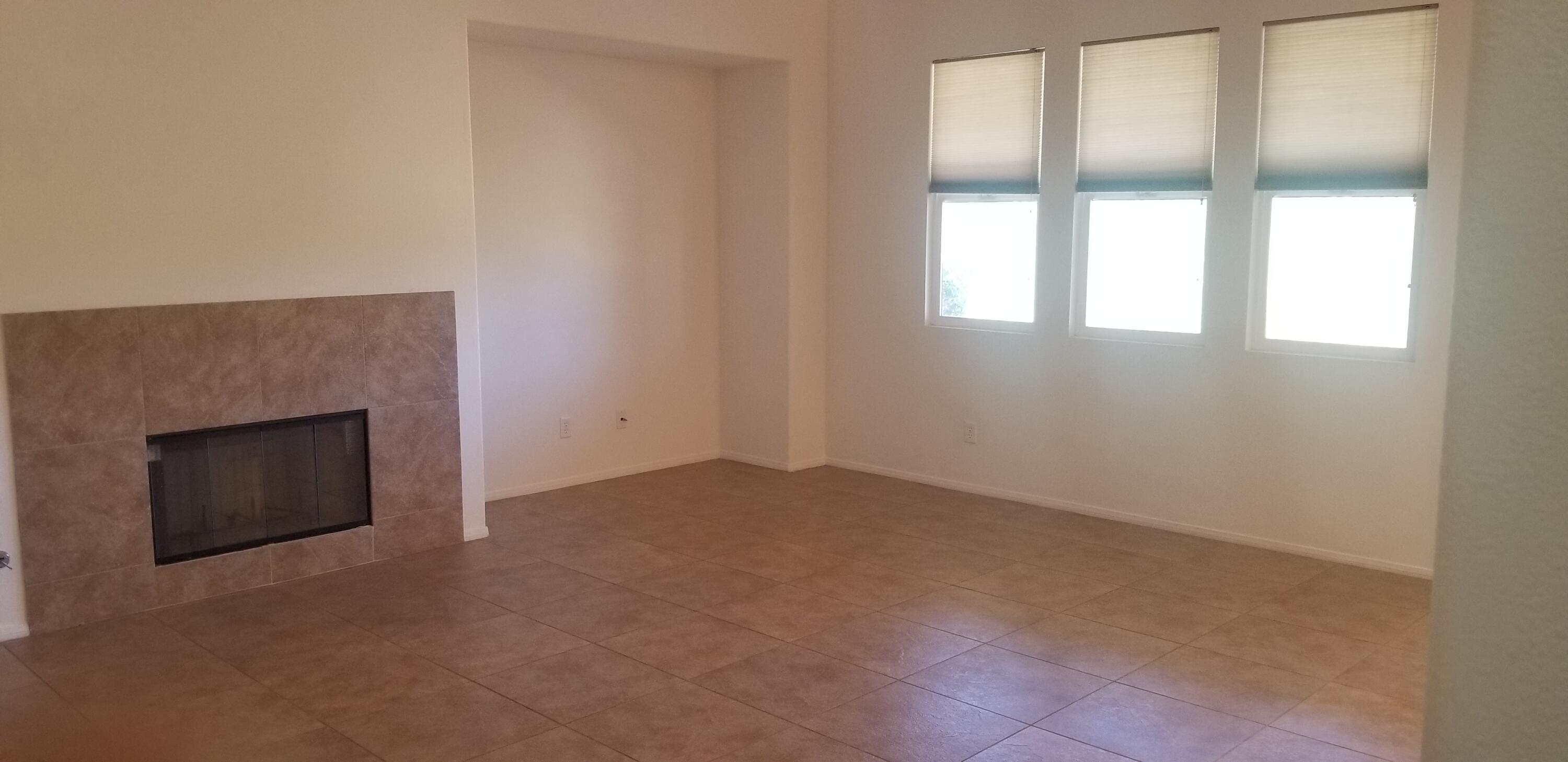 42375 Warner Trail Palm Desert, CA 92211 - Photo 9 of 33 a view of an empty room with a fireplace and a window