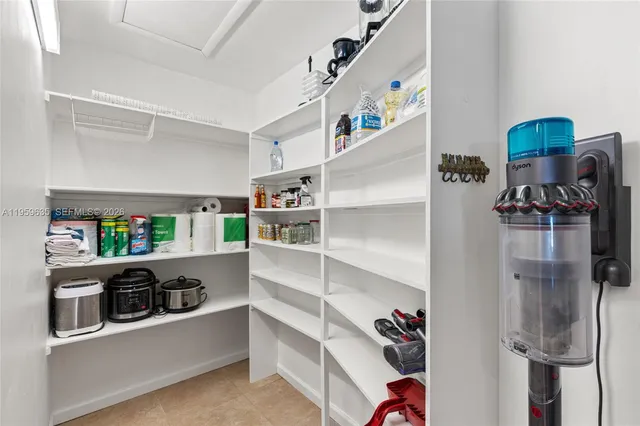a kitchen with stainless steel appliances a refrigerator and a sink