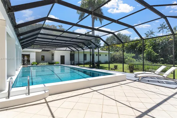 a view of a backyard with sitting area
