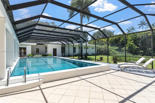 a view of a backyard with sitting area