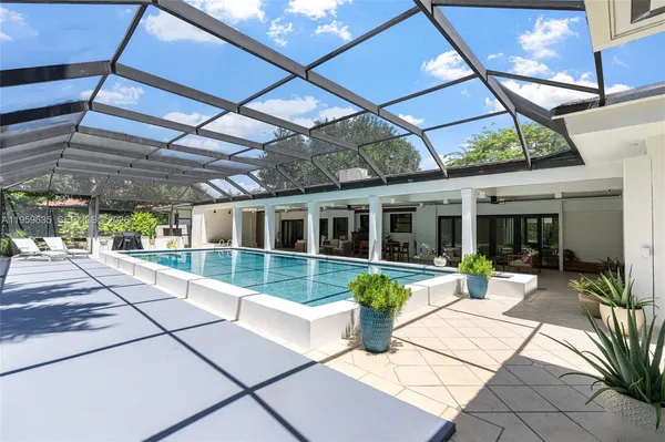 a view of a house with sitting area and garden