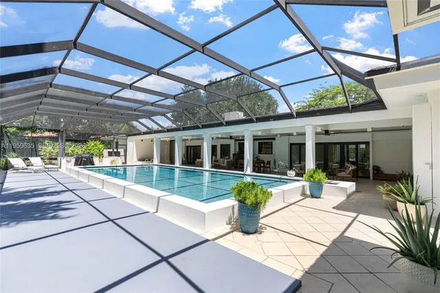 a view of a house with sitting area and garden