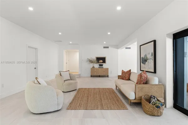 a living room with furniture and a couch