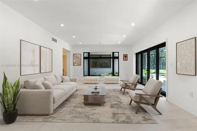 a living room with furniture or window and a table