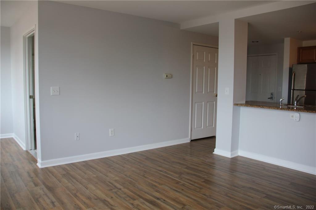 300 Broad Street, Unit 607 Stamford, CT 06901 - Photo 13 of 25 a view of a kitchen with wooden floor