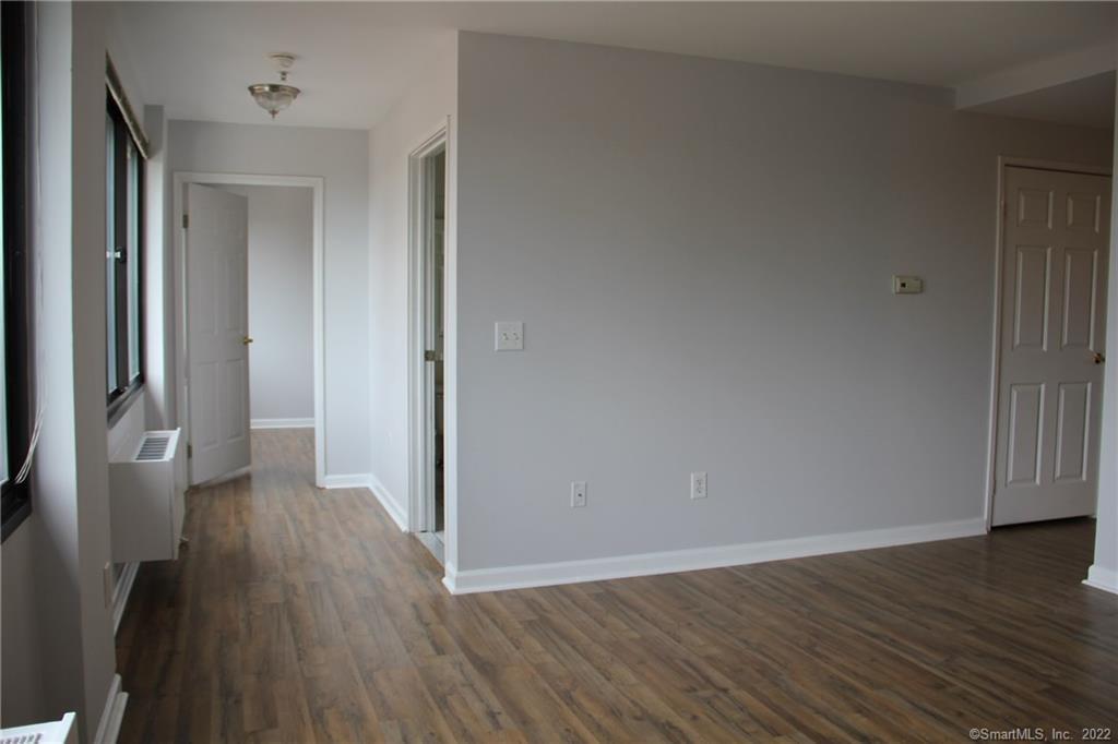 300 Broad Street, Unit 607 Stamford, CT 06901 - Photo 14 of 25 a view of a hallway with wooden floor
