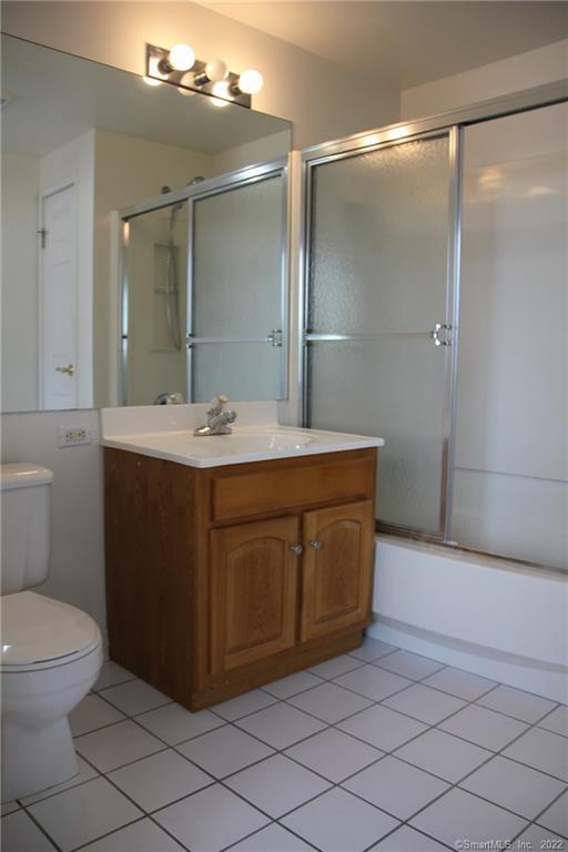 300 Broad Street, Unit 607 Stamford, CT 06901 - Photo 22 of 25 a bathroom with a sink a toilet and shower