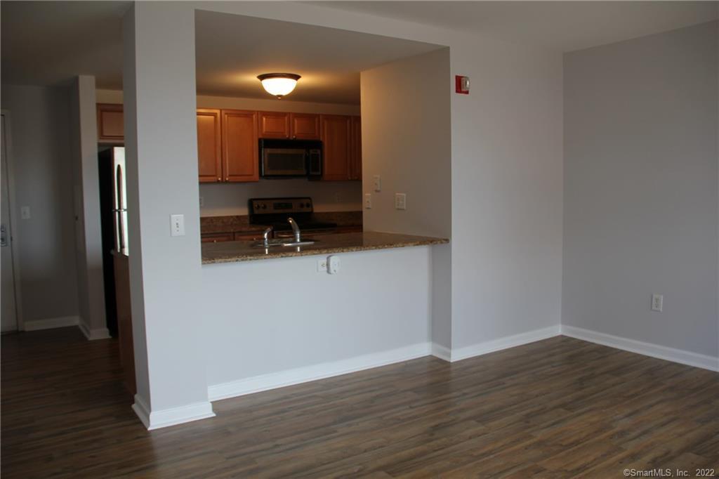 300 Broad Street, Unit 607 Stamford, CT 06901 - Photo 9 of 25 a view of a living room with hardwood floor