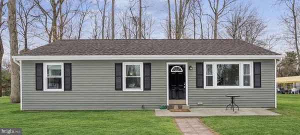 a view of house with yard