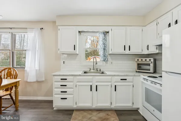 a view of a dining room with furniture and window