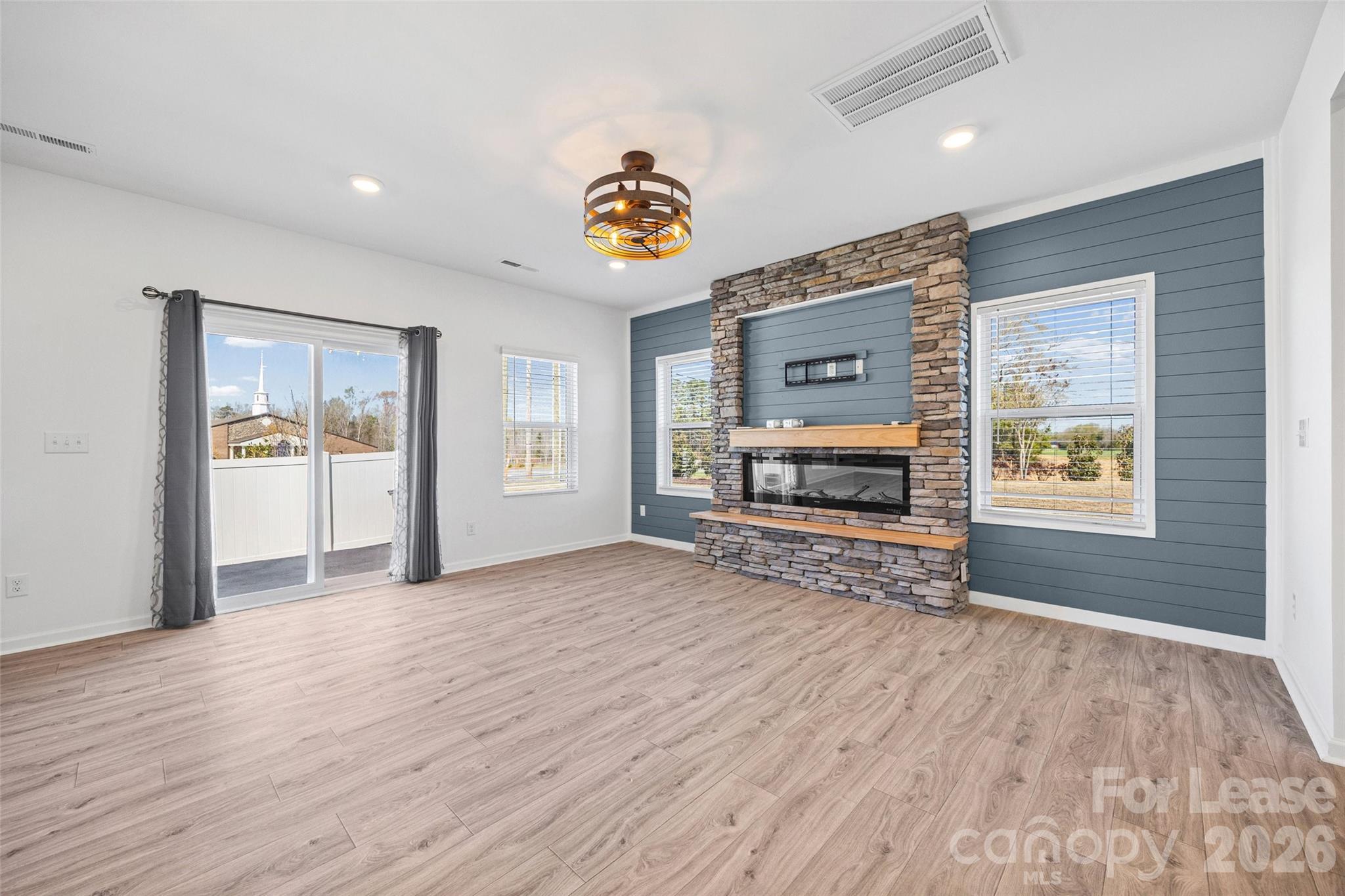 512 Station Street Clover, SC 29710 - Photo 12 of 34 an empty room with windows and fireplace