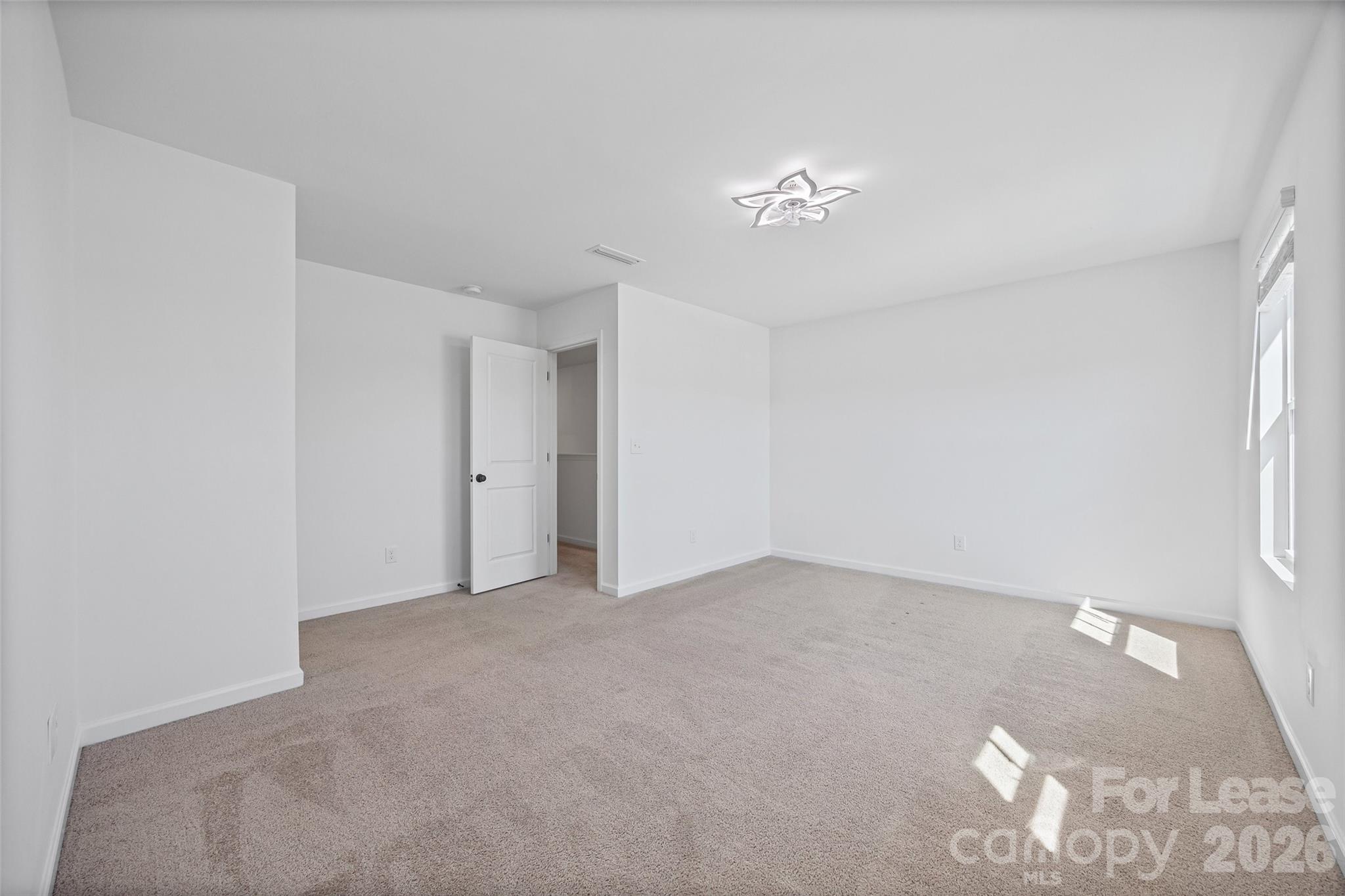 512 Station Street Clover, SC 29710 - Photo 19 of 34 a view of an empty room with a chandelier fan