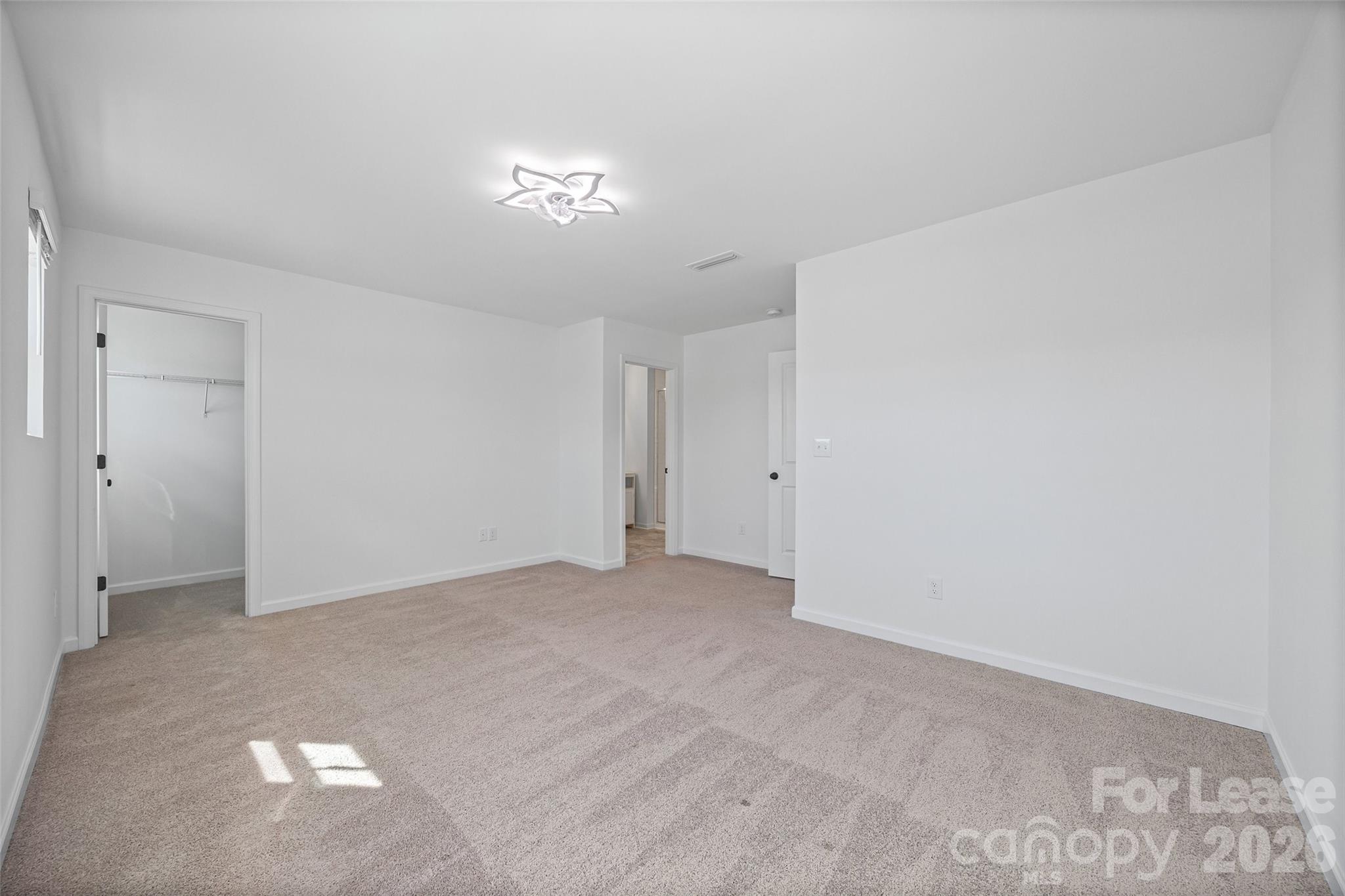 512 Station Street Clover, SC 29710 - Photo 20 of 34 a view of an empty room with a chandelier fan