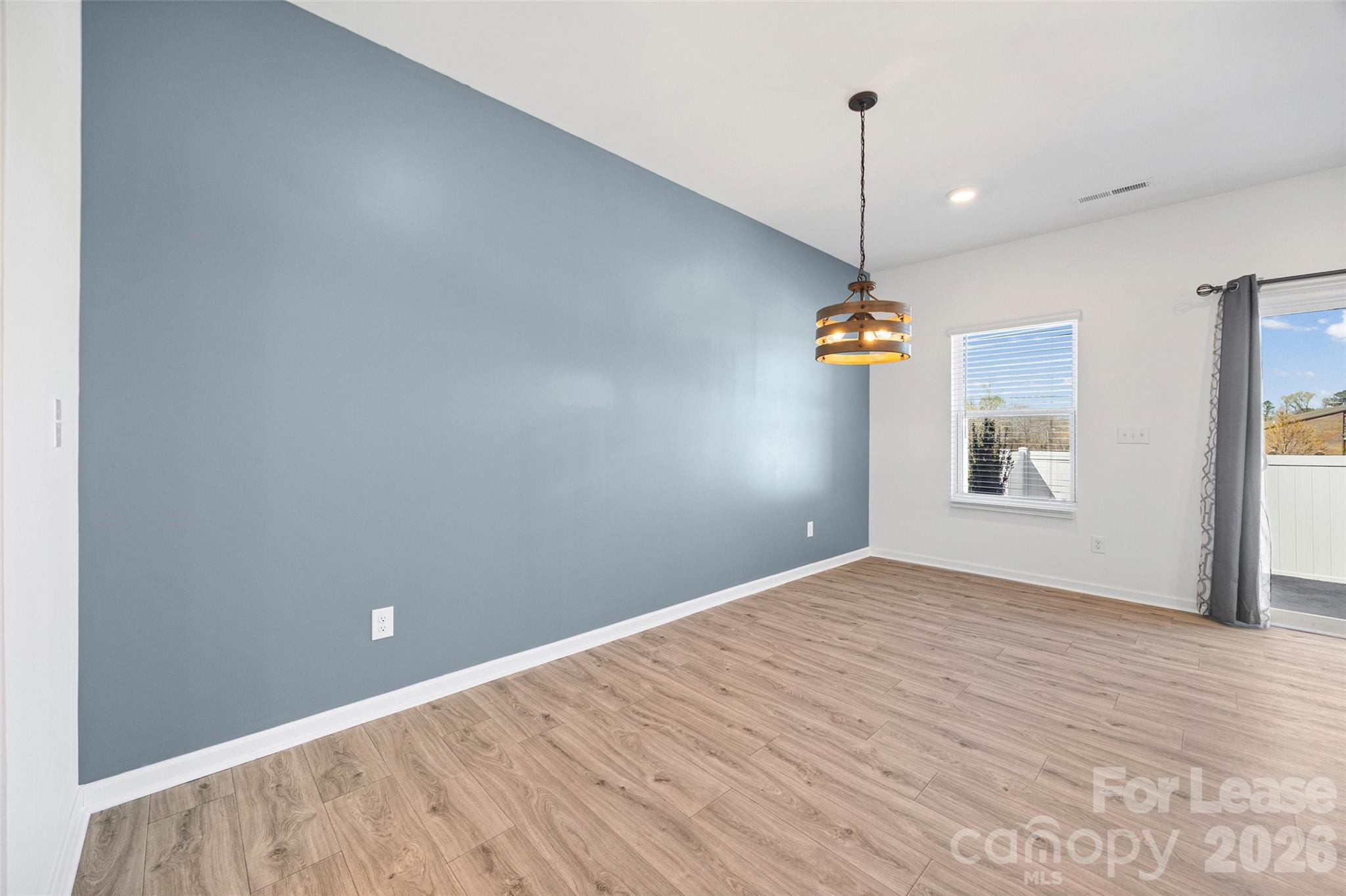 512 Station Street Clover, SC 29710 - Photo 9 of 34 a view of a room with wooden floor and a ceiling fan
