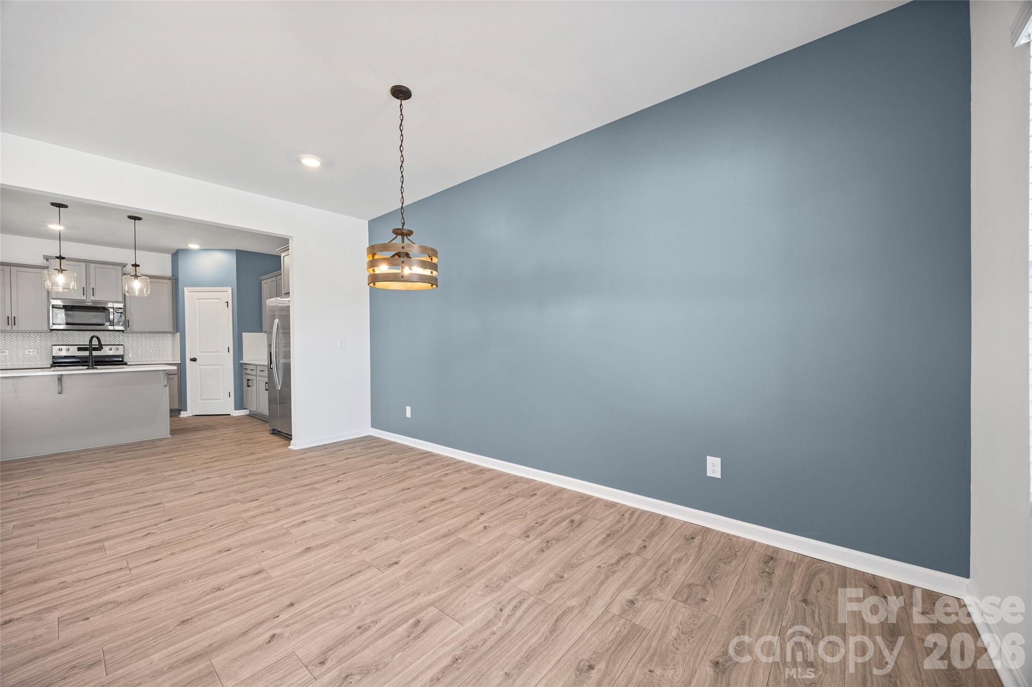 512 Station Street Clover, SC 29710 - Photo 10 of 34 a view of a kitchen with a sink and dishwasher wooden floor