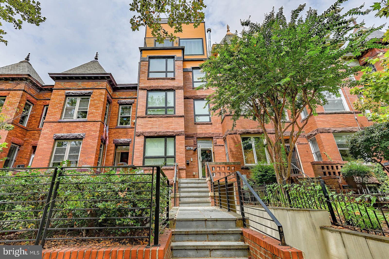 1461 Chapin Street Northwest Washington, DC 20009 - Photo 1 of 67 Charming brick facade with lush greenery.