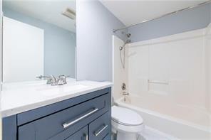 210 Walker Street Southwest, Unit 1 Atlanta, GA 30313 - Photo 28 of 37 a bathroom with a granite countertop sink toilet and shower
