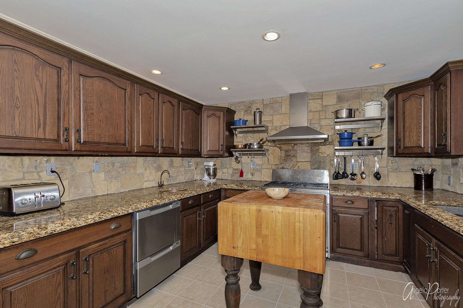 1018 Sunset Road Spring Grove, IL 60081 - Photo 11 of 54 a kitchen with granite countertop sink stainless steel appliances and cabinets