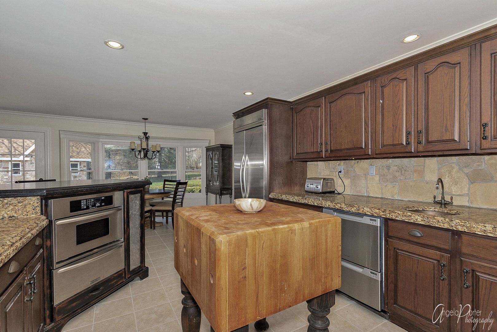 1018 Sunset Road Spring Grove, IL 60081 - Photo 12 of 54 a kitchen with stainless steel appliances granite countertop a stove a sink dishwasher and a refrigerator