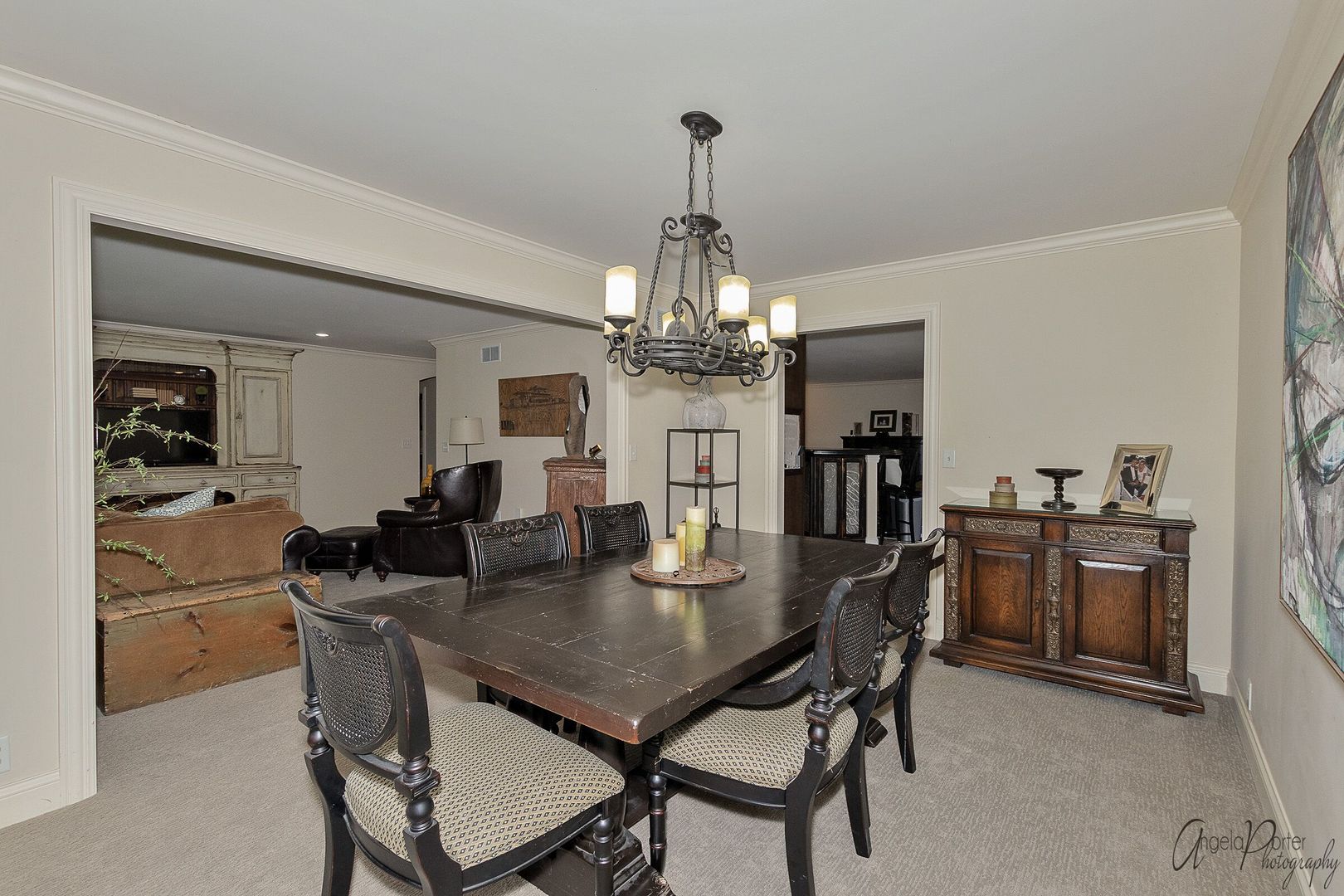 1018 Sunset Road Spring Grove, IL 60081 - Photo 15 of 54 a dining room with wooden floor a chandelier a wooden table and chairs