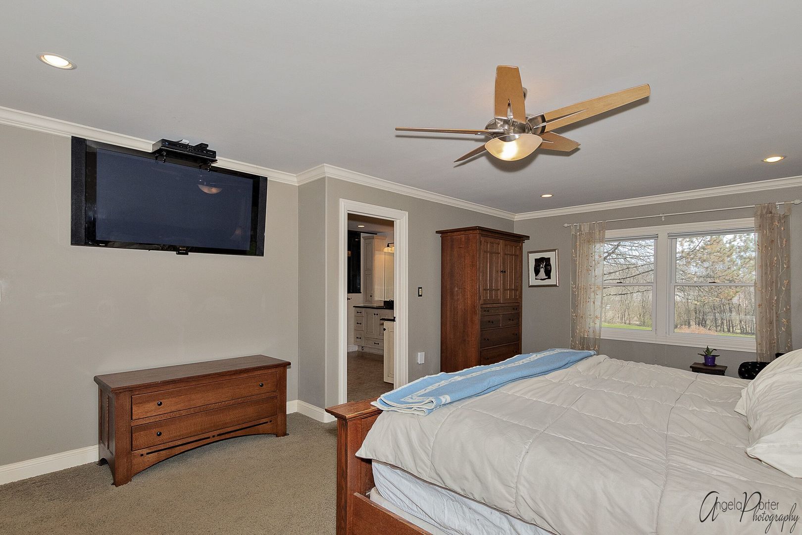 1018 Sunset Road Spring Grove, IL 60081 - Photo 20 of 54 a bedroom with a bed and a chandelier