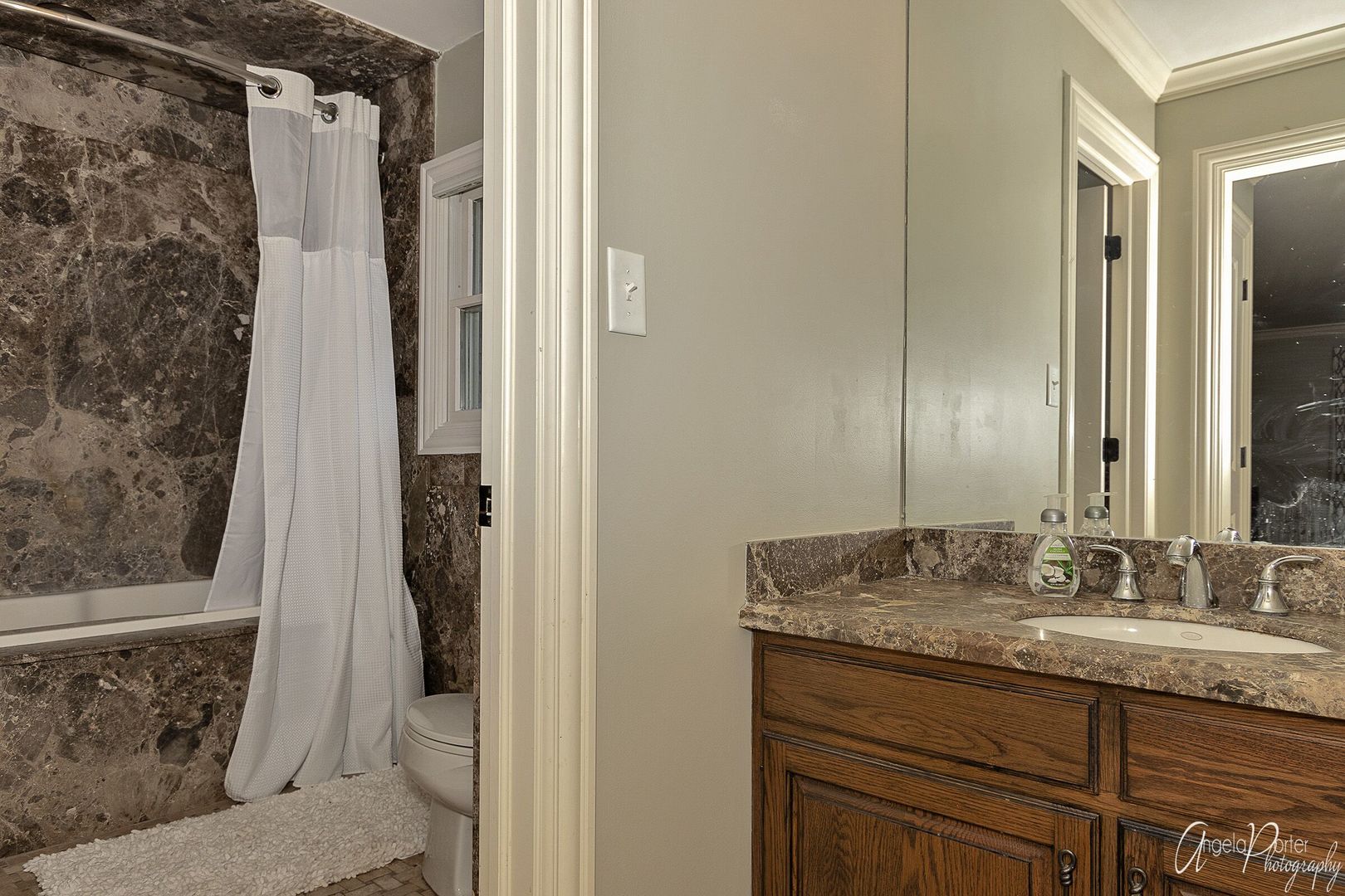 1018 Sunset Road Spring Grove, IL 60081 - Photo 26 of 54 a bathroom with a granite countertop sink and a mirror