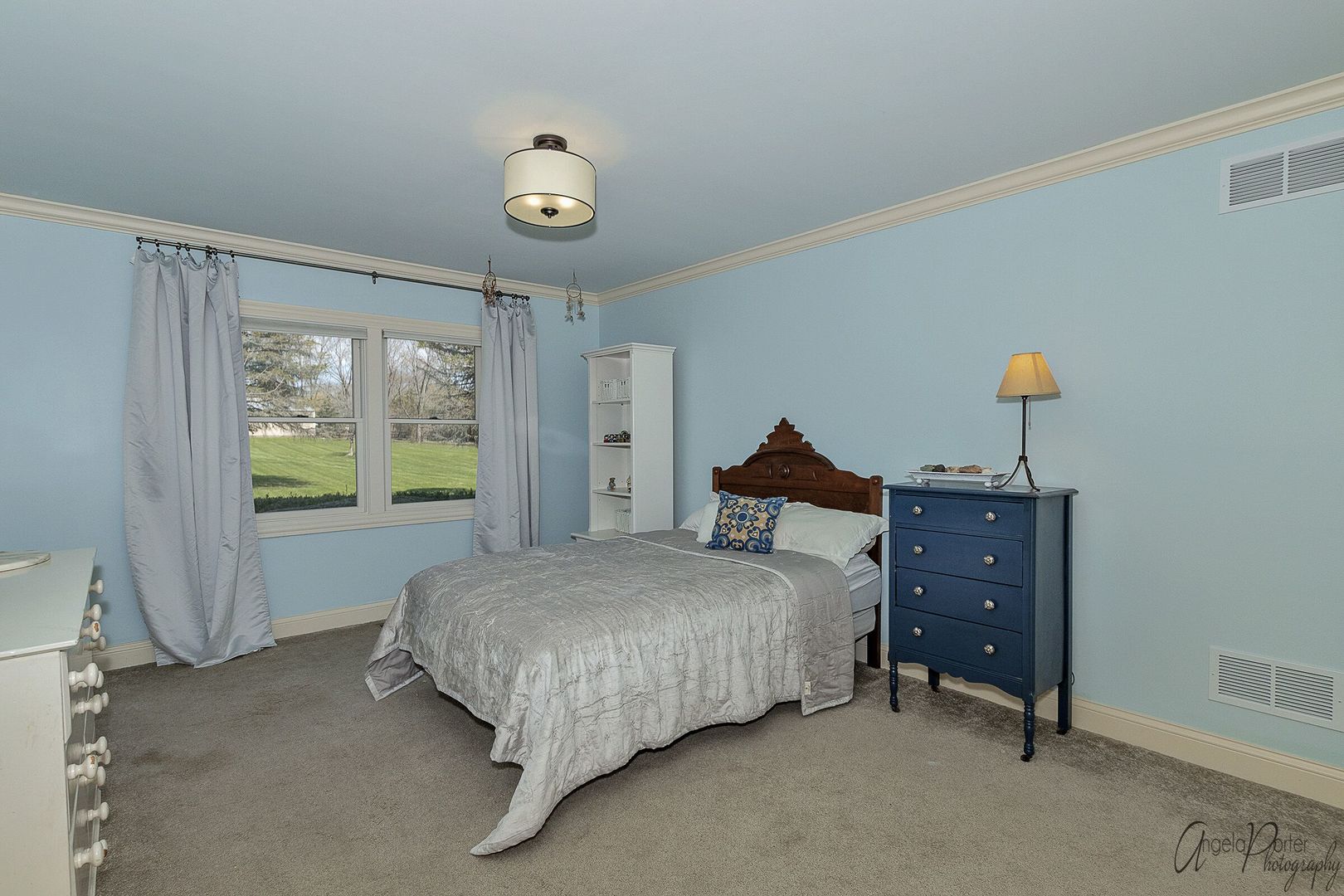 1018 Sunset Road Spring Grove, IL 60081 - Photo 27 of 54 a bedroom with a bed and a chandelier