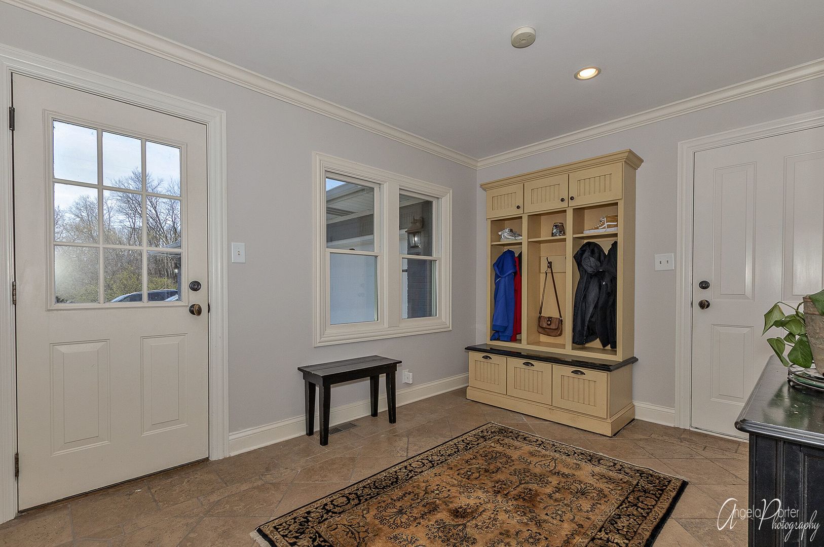 1018 Sunset Road Spring Grove, IL 60081 - Photo 30 of 54 a living room with a rug and a window