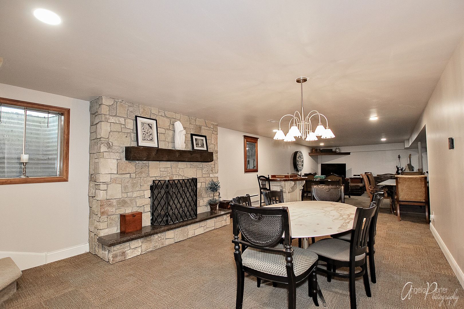 1018 Sunset Road Spring Grove, IL 60081 - Photo 35 of 54 a dining room with wooden floor a chandelier a wooden table and chairs