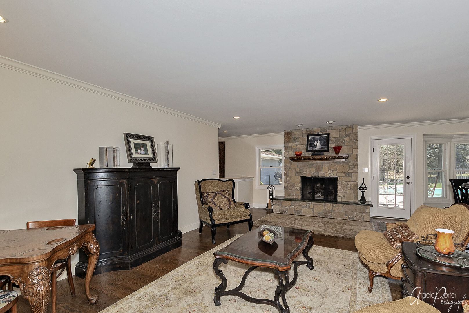 1018 Sunset Road Spring Grove, IL 60081 - Photo 7 of 54 a living room with furniture a fireplace and a table
