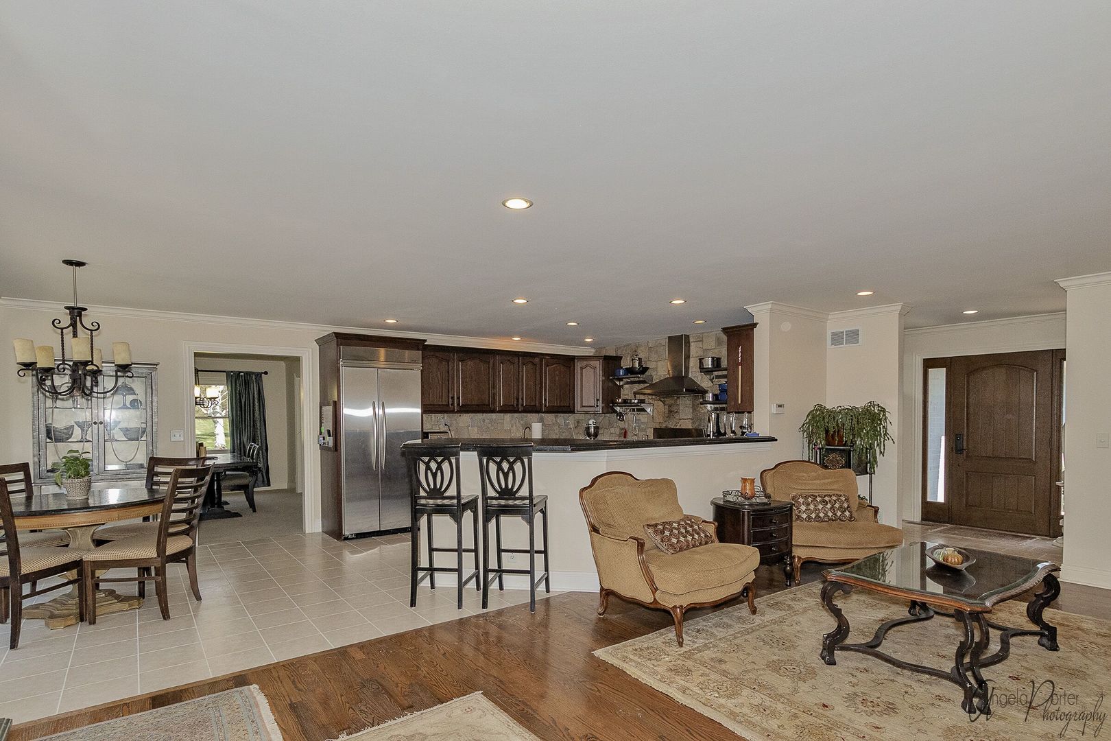 1018 Sunset Road Spring Grove, IL 60081 - Photo 8 of 54 a living room with furniture kitchen view and a dining table