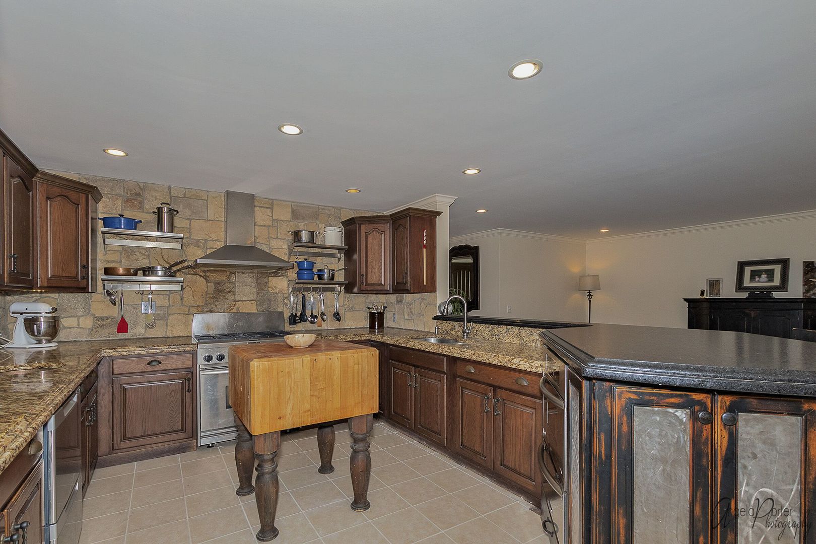 1018 Sunset Road Spring Grove, IL 60081 - Photo 9 of 54 a kitchen with stainless steel appliances granite countertop a sink a stove top oven a counter space and cabinets