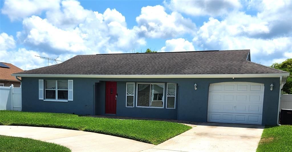 3904 Ming Tree Drive New Port Richey, FL 34652 - Photo 1 of 1 a front view of a house with a garden