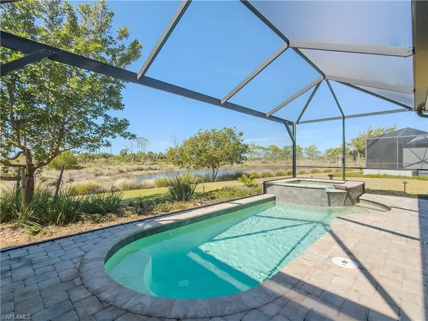 a view of a swimming pool with a patio